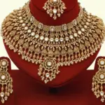 Heavy bridal brass choker necklace set with earrings and maang tikka in antique gold finish