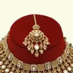 Heavy bridal brass choker necklace set with earrings and maang tikka in antique gold finish