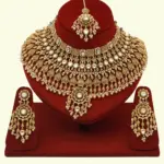 Heavy bridal brass choker necklace set with earrings and maang tikka in antique gold finish